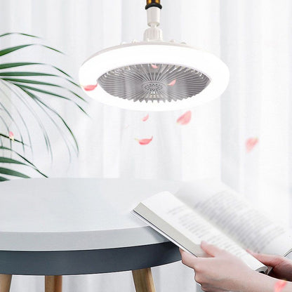 Person using a cleaning tool under a ceiling light fixture with pink leaves on a white curtain background