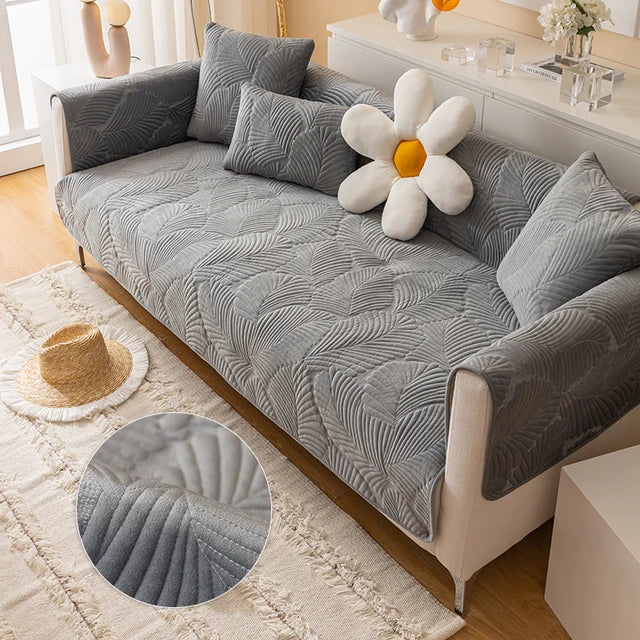 Gray textured sofa cover on a sofa with decorative pillows and a close-up of the fabric texture.
