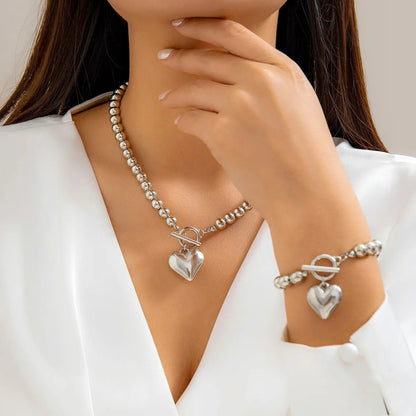 Perlenarmband und Halskettenset mit Herzanhänger 