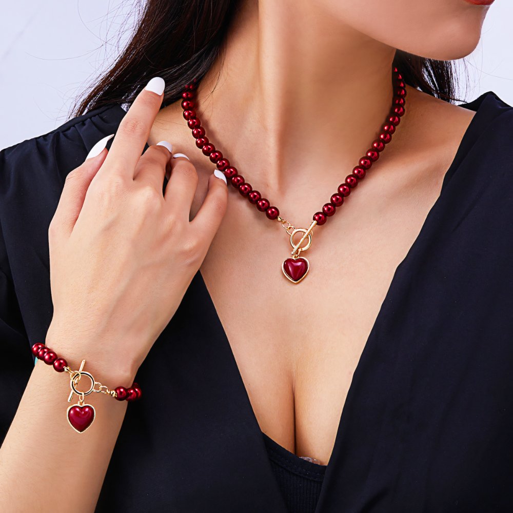 Perlenarmband und Halskettenset mit Herzanhänger 